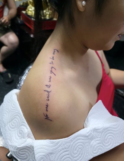 Script name tattoo with elegant calligraphy