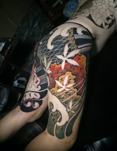 Watercolor tattoo with splashes of color